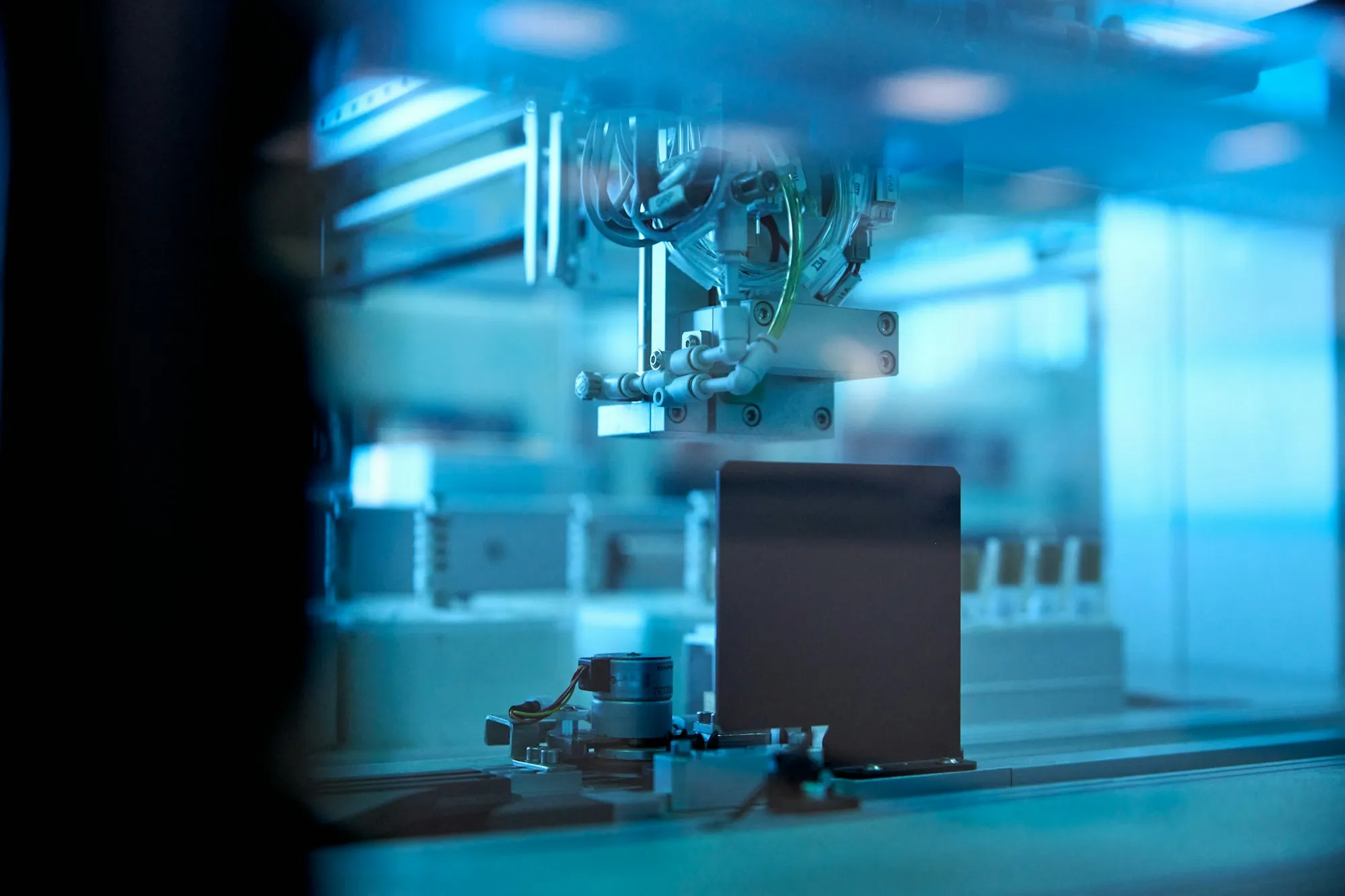 Automated handling equipment inside a controlled enclosure